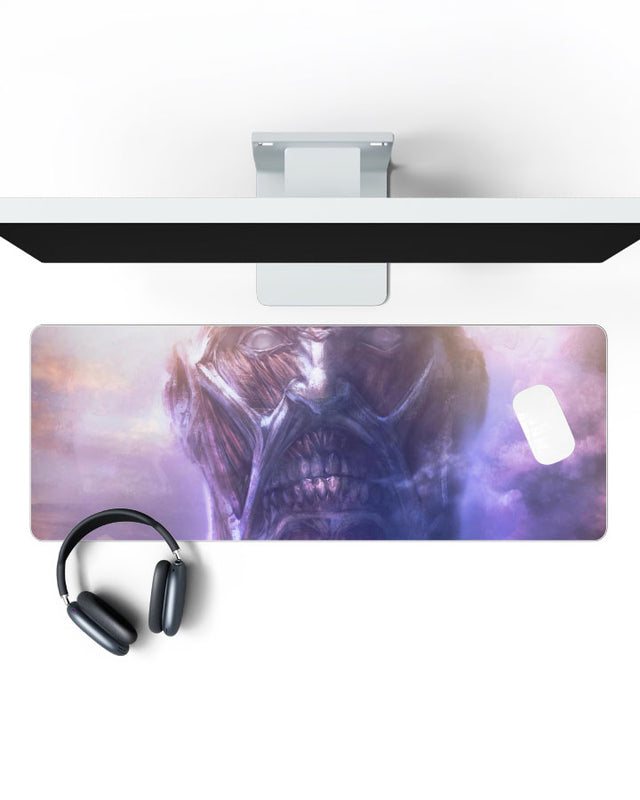 Colossal Titan โ Portrait Gaming Desk Mat on a desk, top view