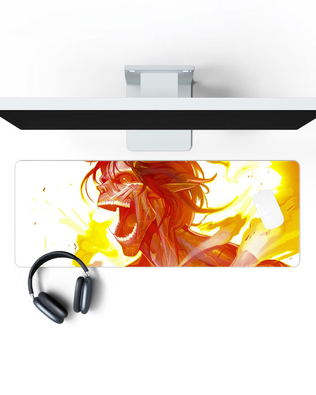 Attack Titan โ Inferno Gaming Desk Mat on a desk, top view