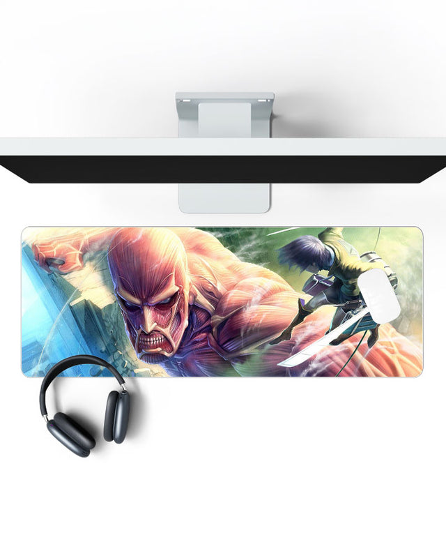 Colossal Titan – Wall Breach Gaming Desk Mat on a desk, top view