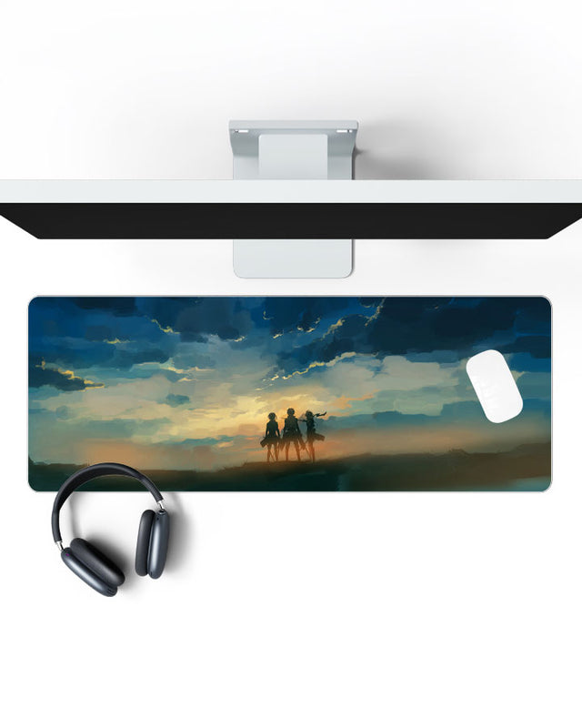 Eren, Mikasa & Armin Gaming Desk Mat on a desk, top view