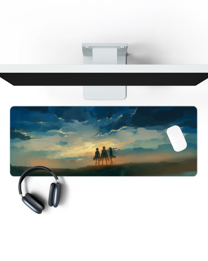 Eren, Mikasa & Armin Gaming Desk Mat on a desk, top view