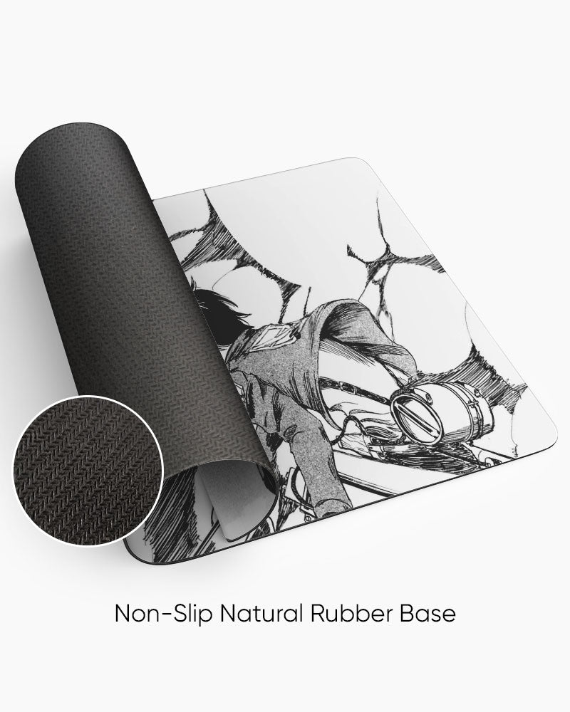 Eren Yeager vs Colossal Titan – Manga Gaming Desk Mat rolled to show the natural rubber base