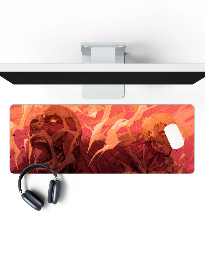 Colossal Titan & Armored Titan Gaming Desk Mat on a desk, top view