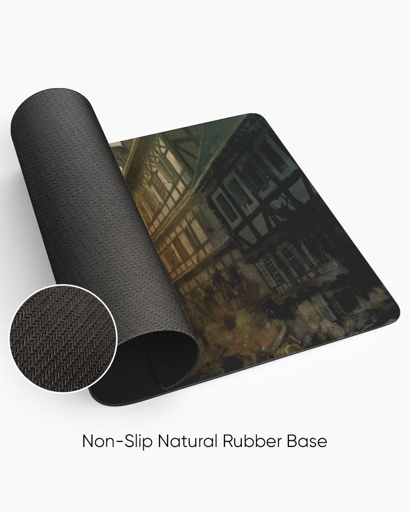 Colossal Titan – Titan Invasion Gaming Desk Mat rolled to show the natural rubber base
