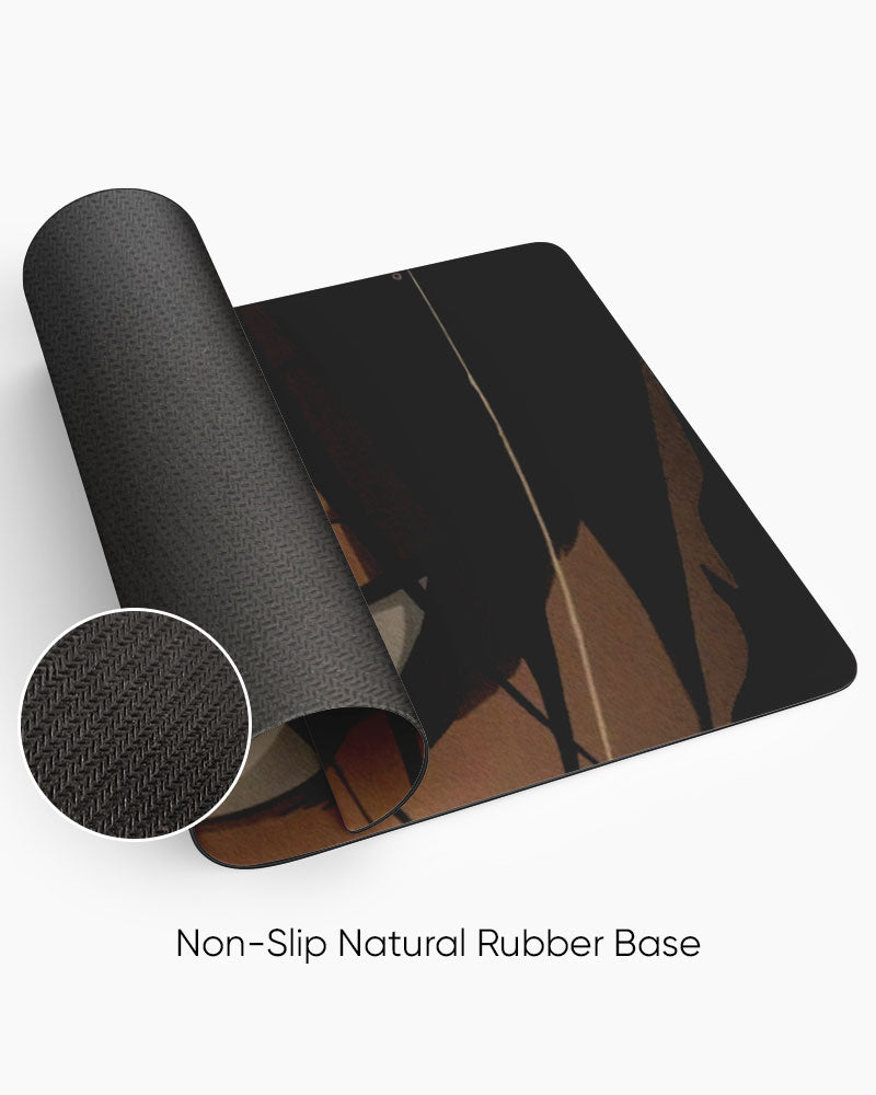 Eren Yeager – Glare Gaming Desk Mat rolled to show the natural rubber base